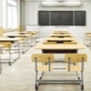 Rows of student desks in a classroom.
